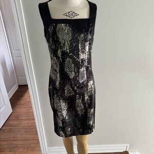 Roberto Cavalli Black and GoldSheath.Dress. Ptp 16” lenght 37,5”Italian size 44